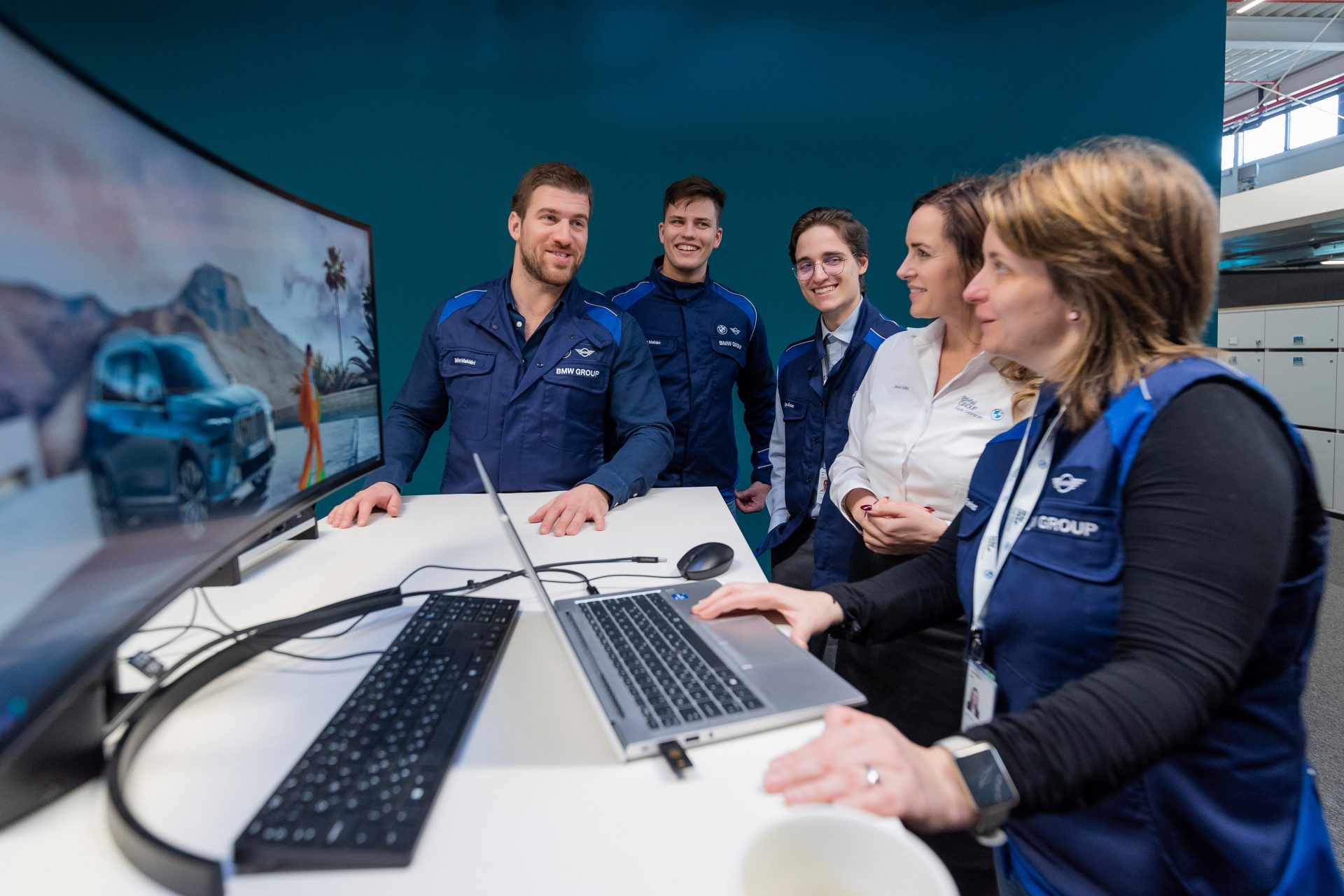 A woman is showing a group of people something on her screen