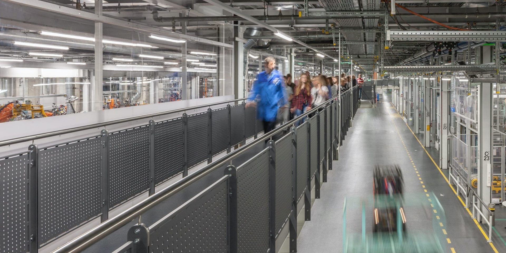 Internal view of the BMW plan Munich with a guided tour in the background