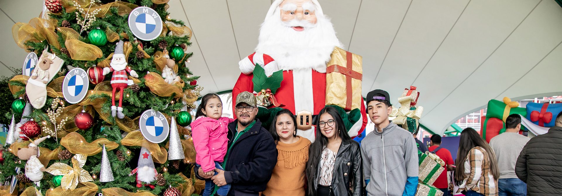 Family standing in front of Santa