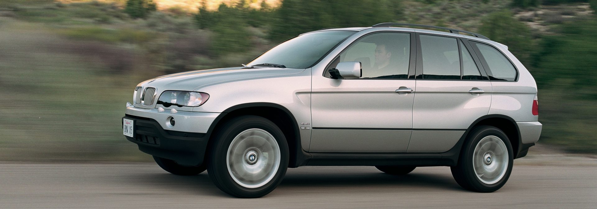 X5 beauty shot on road at dusk. 