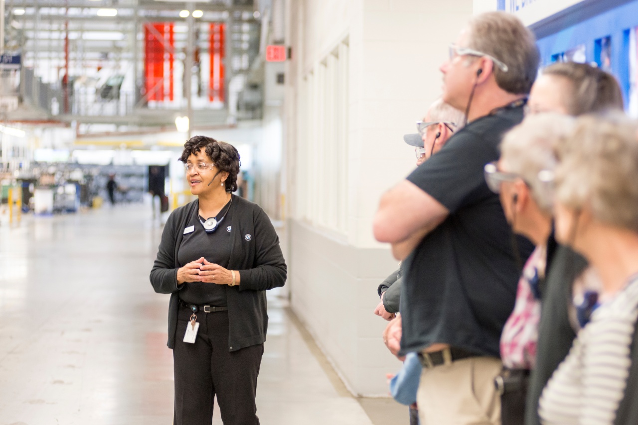 Tour Guide and guests look on as production takes place. 