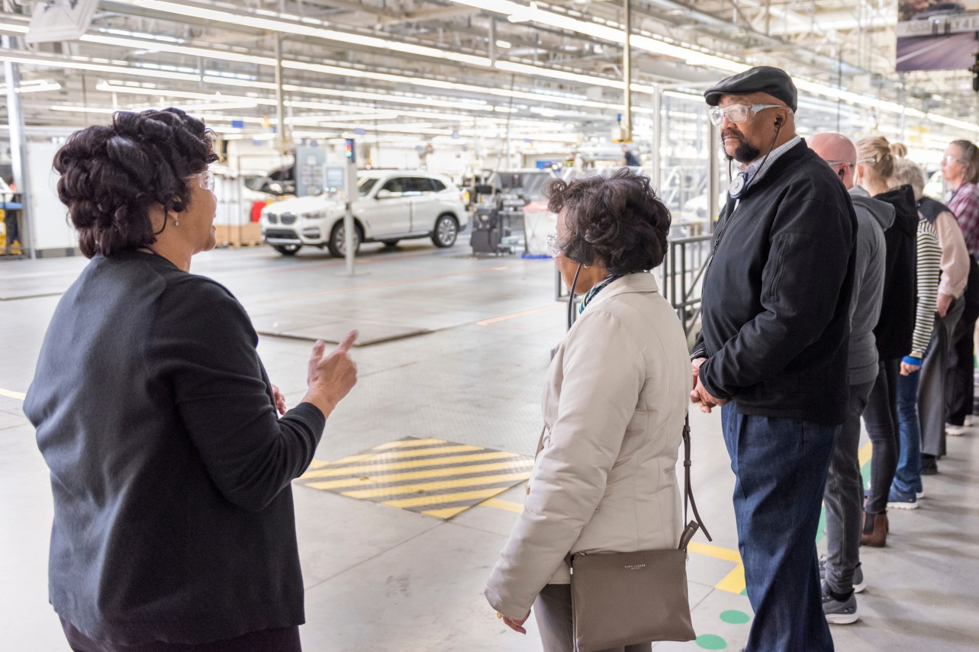 Tour Guide explaining final processes before the vehicle leaves assembly. 