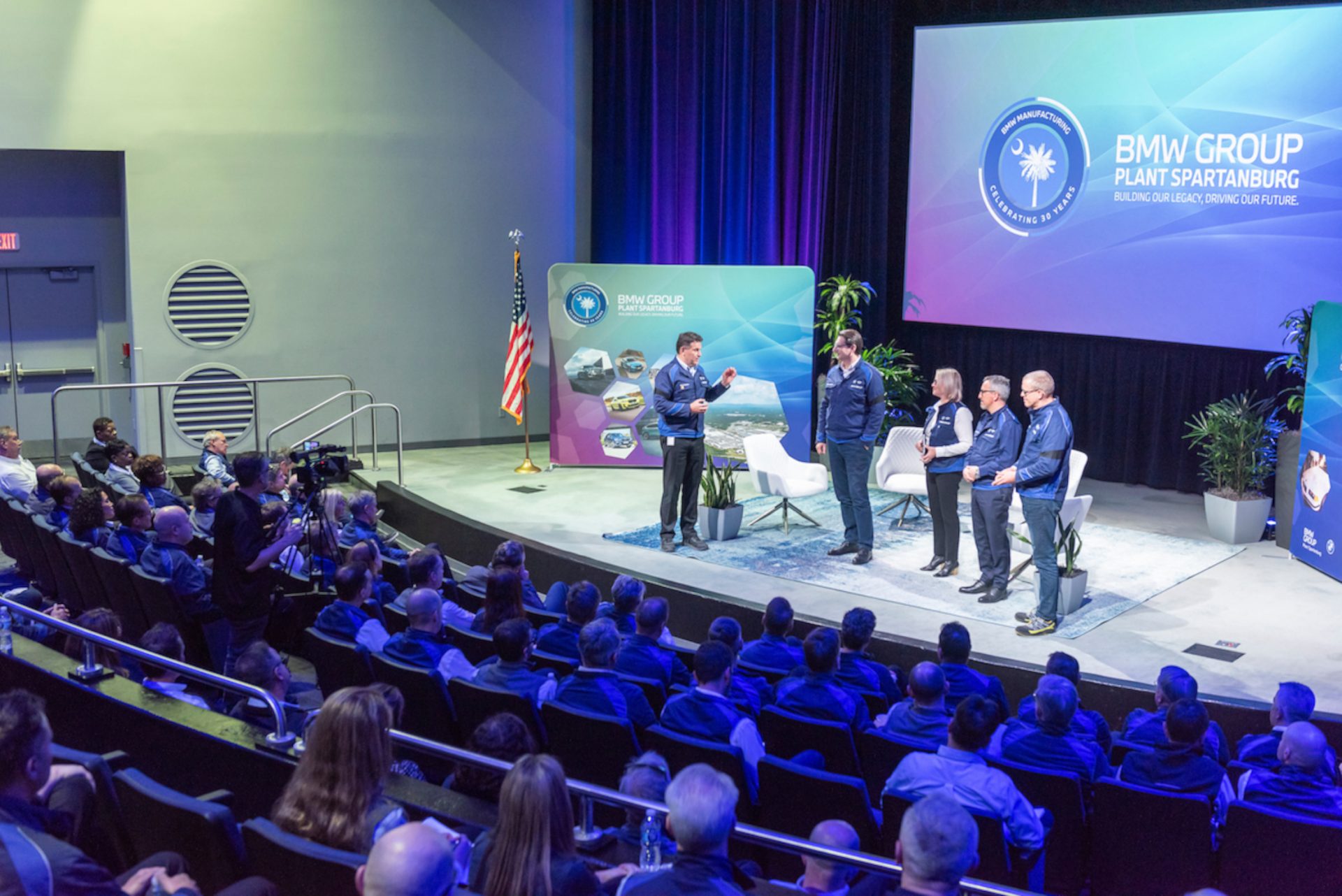 Guests seated in the Zentrum Auditorium during a presentation. 