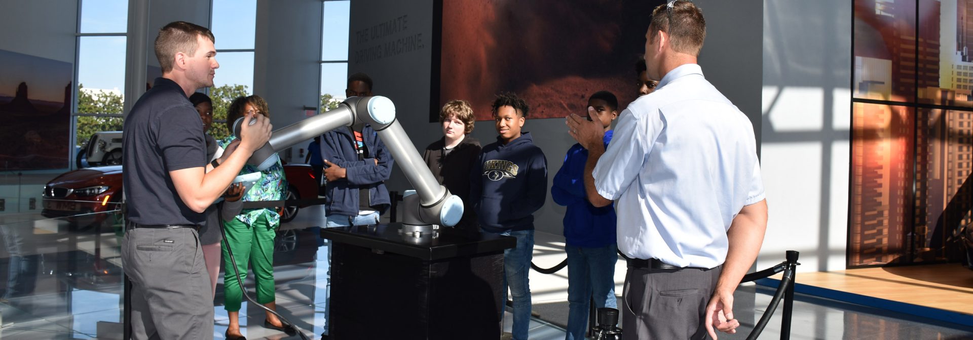 BMW Scholars show students how they can interact with a programmed robot. 