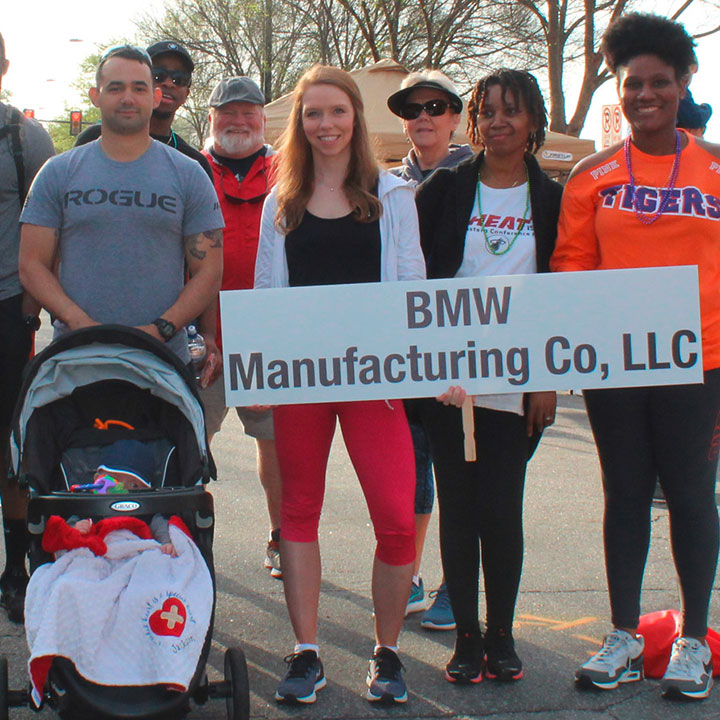 BMW team gathers for a group picture at the American Heart Association's Heart Walk. 