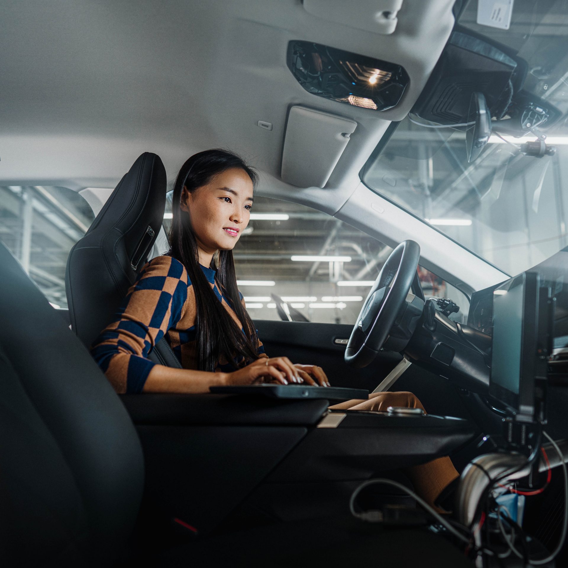 BMW Group employee in a car