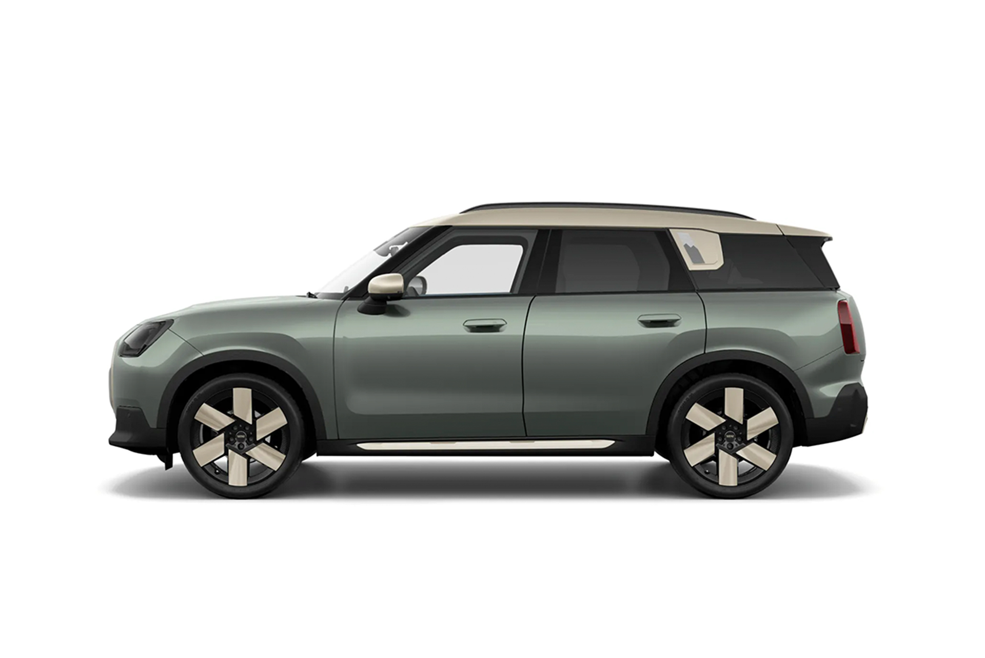 Green MINI Countryman against a white background.