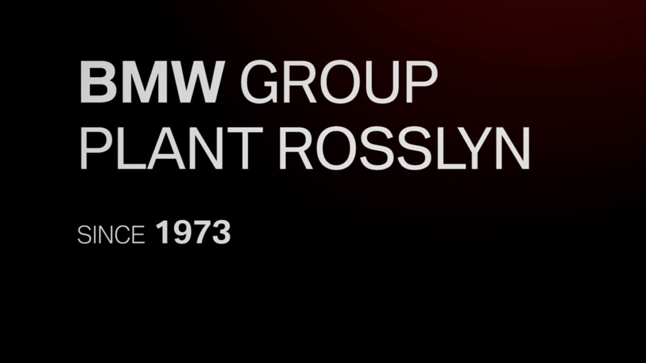 Videoteaser: Dark background with BMW Group Plant Rosslyn since 1973 written on it.